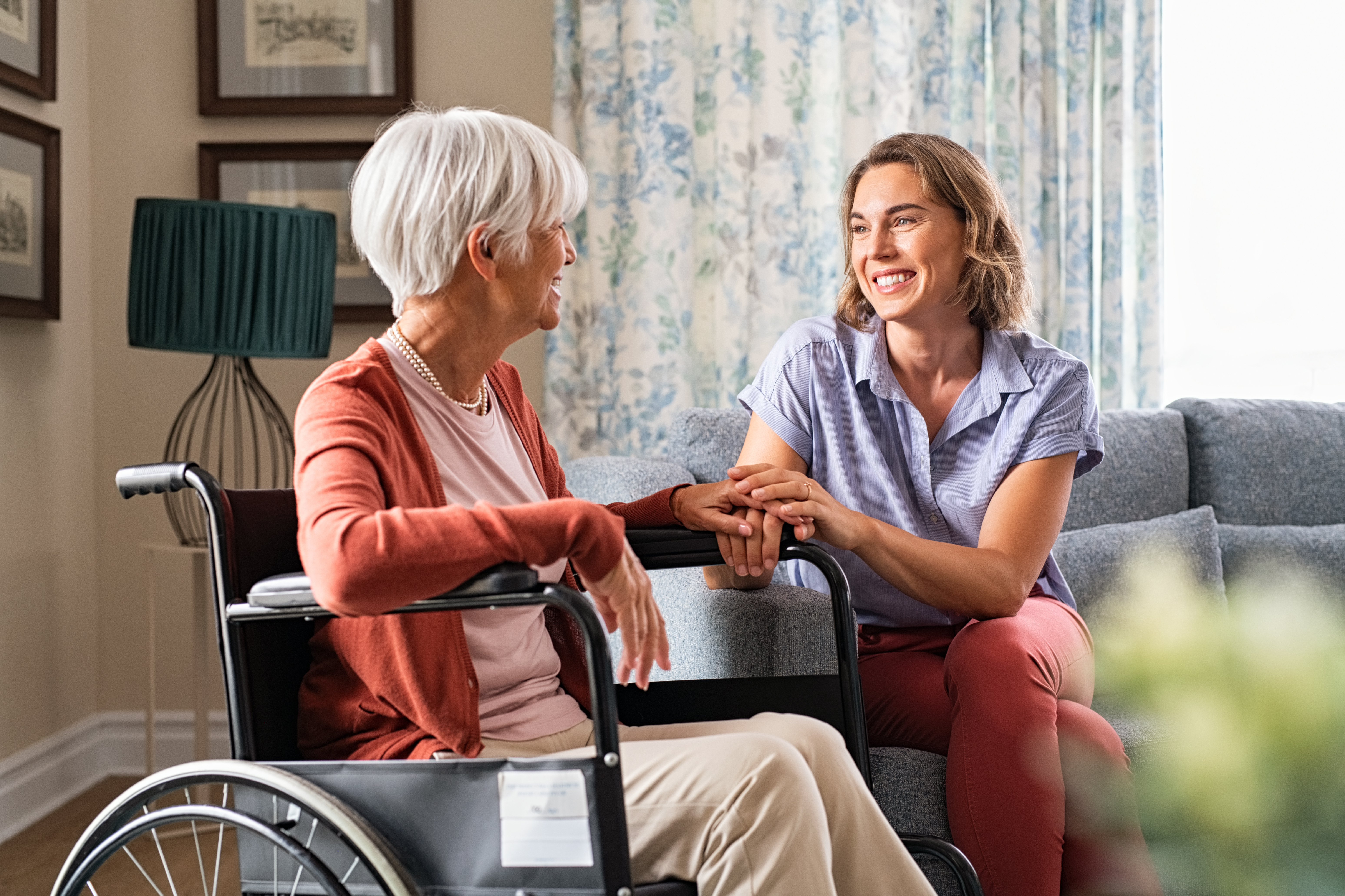 healthcare-carer-providing-personal-support-to-elderly-resident-at-home.jpeg